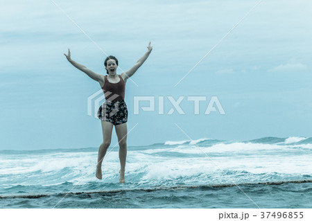 Girl Jumping Leap Beach Tidal Pool Ocean Girl Jumping Leap Beach Tidal Pool Ocean 37496855