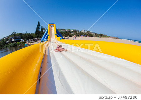 Beach Water Slide Rides Boy Teenager Beach Water Slide Rides Boy Teenager 37497280