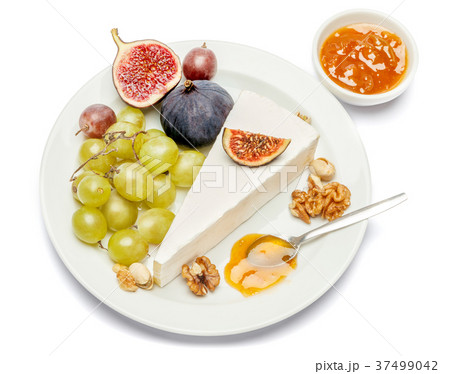 Piece of brie or camambert cheese on a white Piece of brie or camambert cheese on a white 37499042