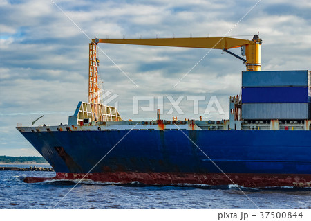 Blue container ship underway Blue container ship underway 37500844