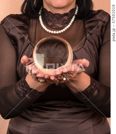 Woman with magic ball 37501019