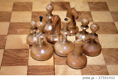 White chess pieces on a chess board 37501432