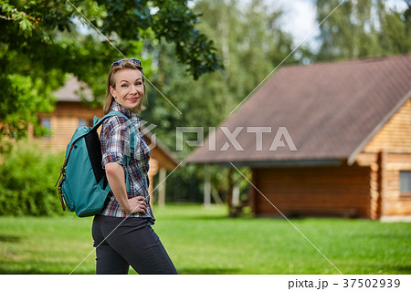 young woman with nordic walk pols 37502939