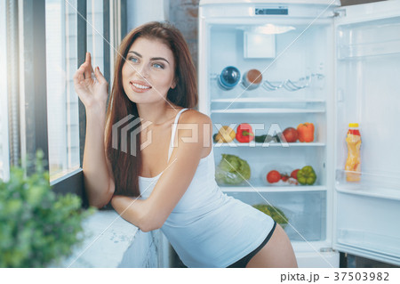 Young sexy woman in the kitchen lifestyle 37503982