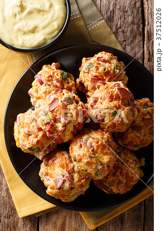Freshly baked delicious sausage balls with cheese Freshly baked delicious sausage balls with cheese 37512026