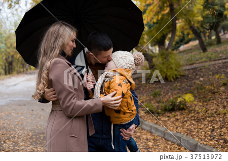 family in autumn in forest rain umbrella 37513972
