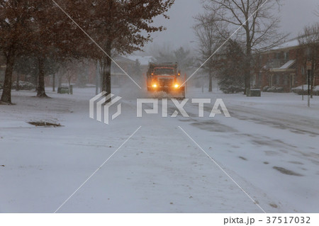 Snowplow removing snow from city road Snowplow removing snow from city road 37517032