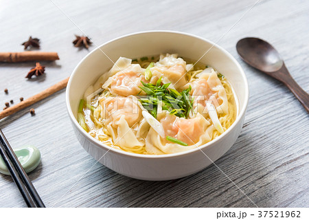 Shrimp wonton with braised pork in soup on table 37521962
