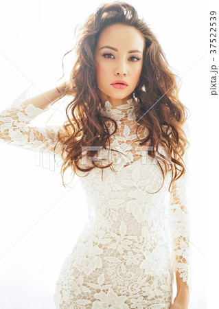 Beautiful woman in white dress 37522539
