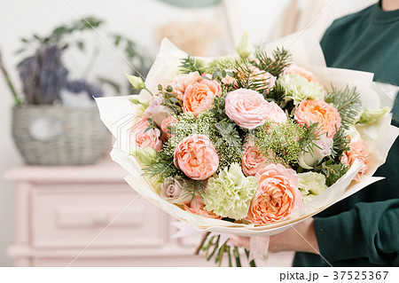 beautiful luxury bouquet of mixed flowers in woman 37525367