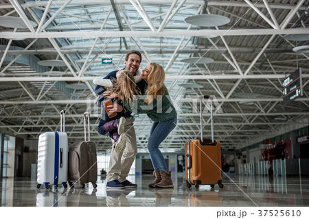 Loving mom and dad are happy seeing their kid Loving mom and dad are happy seeing their kid 37525610