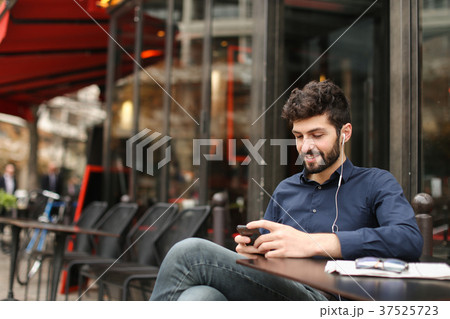 Lucky businessman chatting by smartphone and 37525723