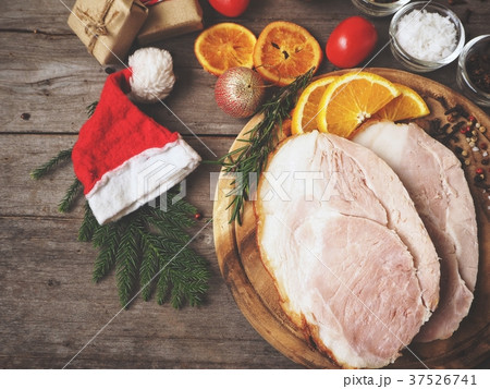Baked honey ham with christmas decorations Baked honey ham with christmas decorations 37526741