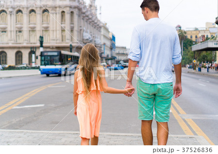 Tourist girl and father in popular area in Havana Tourist girl and father in popular area in Havana 37526836