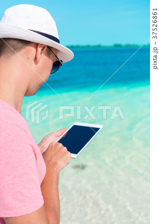 Young man with laptop on the background of Young man with laptop on the background of 37526861
