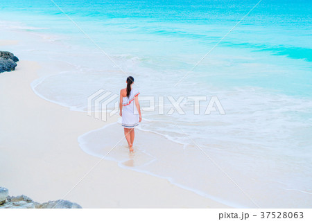 Woman at beach having a lot of fun in shallow Woman at beach having a lot of fun in shallow 37528063