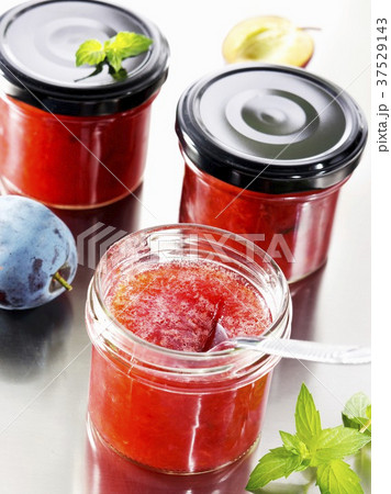 Three jars of plum jam Three jars of plum jam 37529143