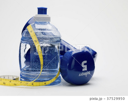 Bottle of water, hand weights and tape measure Bottle of water, hand weights and tape measure 37529950
