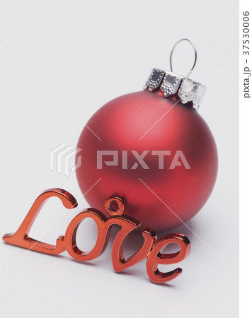 Red Christmas bauble and the word Love Red Christmas bauble and the word Love 37530006