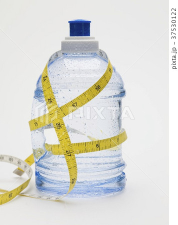 Bottle of water and tape measure Bottle of water and tape measure 37530122