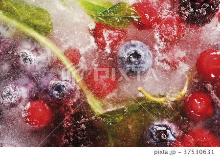 Assorted berries in block of ice 37530631
