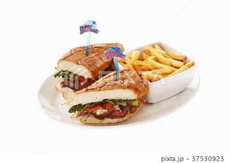 Steak sandwich with dish of chips 37530923