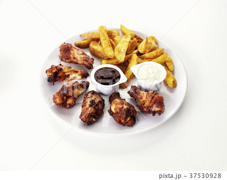 Barbecue chicken wings with potato wedges and dips 37530928