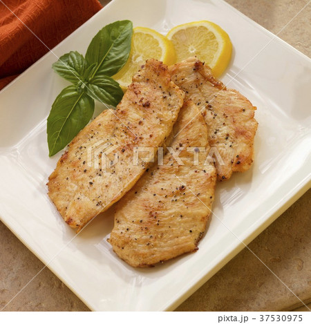 Lemon Pepper Chicken Breast with Basil and Lemon Garnish Lemon Pepper Chicken Breast with Basil and Lemon Garnish 37530975
