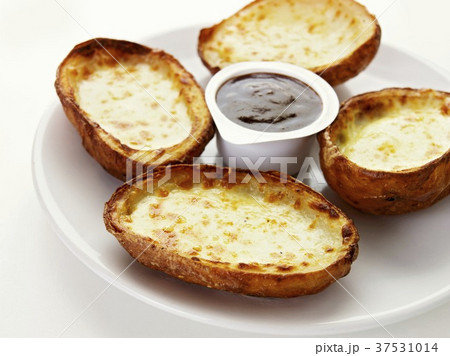 Baked potatoes with cheese and dip 37531014