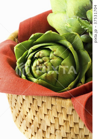 Green artichokes in basket Green artichokes in basket 37531704