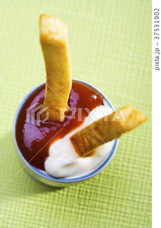 Two chips in ketchup and mayonnaise Two chips in ketchup and mayonnaise 37531902