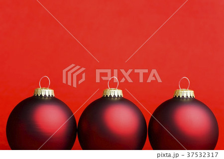 Three dark red Christmas baubles 37532317