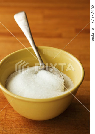 Bowl of sugar with spoon Bowl of sugar with spoon 37532658