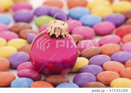 Christmas bauble and coloured chocolate beans 37533199