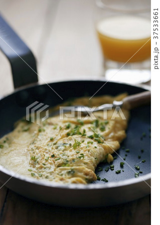 Herb omelette with chives in frying pan Herb omelette with chives in frying pan 37533661