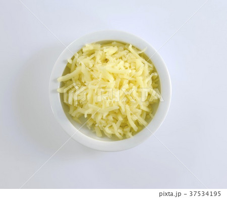 A dish of grated cheese (overhead view) A dish of grated cheese (overhead view) 37534195