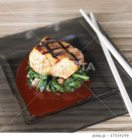 Grilled salmon fillet with greens, achiote and ponzu sauce 37534249