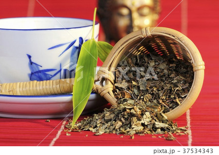 Rhubarb root in tea strainer with cup of tea Rhubarb root in tea strainer with cup of tea 37534343
