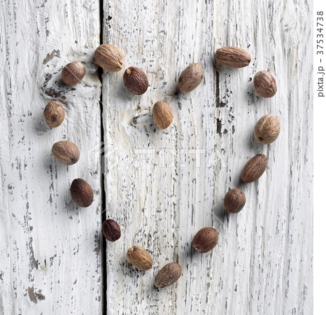 Nutmeg Heart on Rustic White Washed Wood Nutmeg Heart on Rustic White Washed Wood 37534738