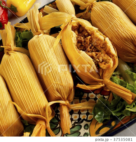 Serving Platter of Meat Filled Tamales; One Cut Open Serving Platter of Meat Filled Tamales; One Cut Open 37535081