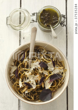 Spaghetti with purple basil pesto and Parmesan cheese Spaghetti with purple basil pesto and Parmesan cheese 37535284