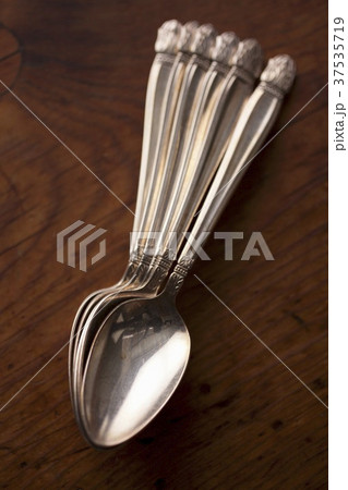 Silver Spoons on a Wooden Table; From Above 37535719