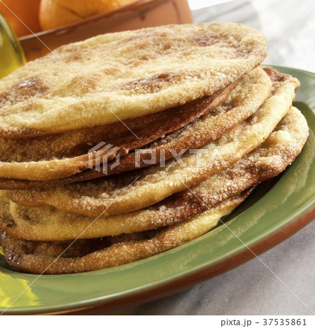 Spanish Sweet Olive Oil Tortas Stacked on a Green Plate 37535861