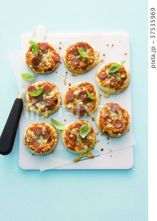 Mini-pizzas with salami 37535969
