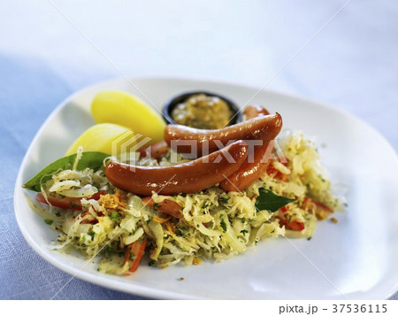 Sausages with cabbage salad, mustard and potatoes 37536115
