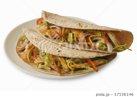 Two Chicken Tacos on Whole Wheat Tortillas; White Plate on White Background 37536146