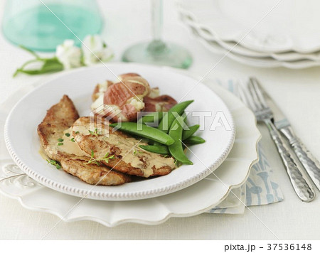 Veal escalope with mange tout 37536148