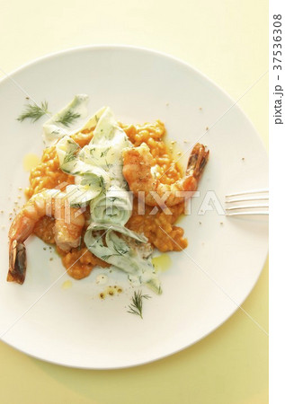 Pepper risotto with scampi, cucumber and dill sauce Pepper risotto with scampi, cucumber and dill sauce 37536308