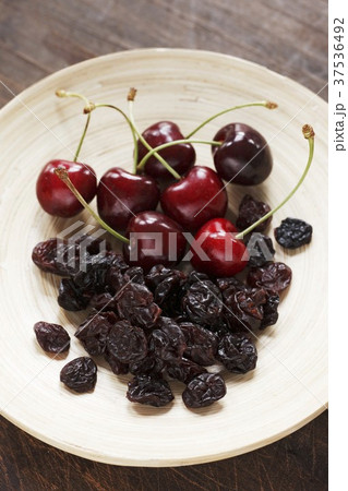 A plate of fresh and dried cherries A plate of fresh and dried cherries 37536492