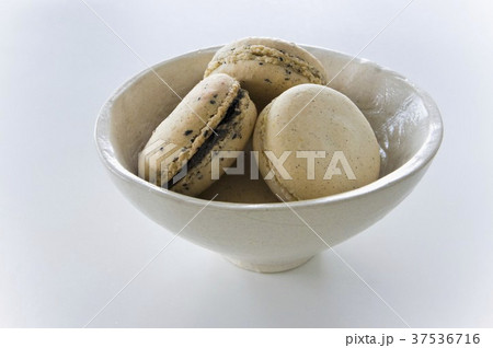 A bowl of sesame seed and Earl Grey macaroons 37536716